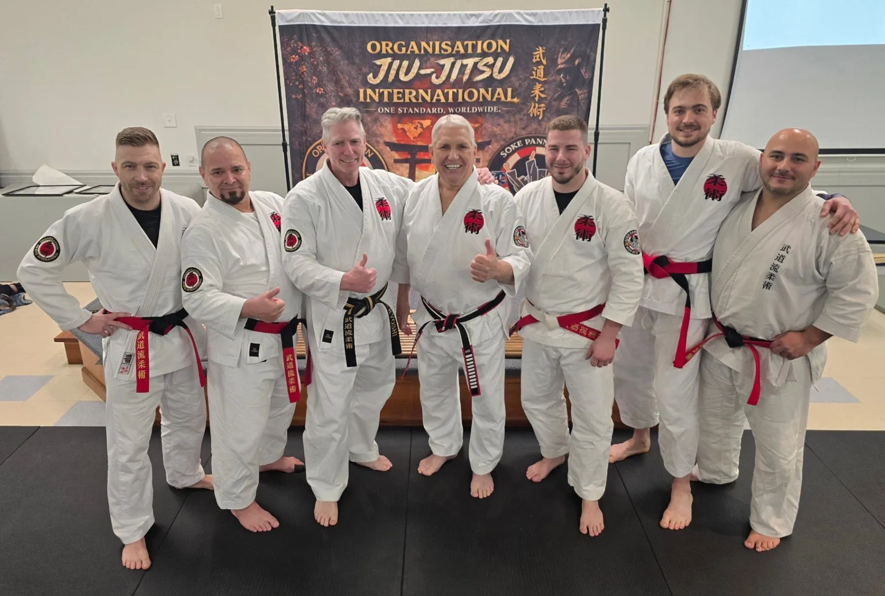 OJI instructors standing together in the dojo