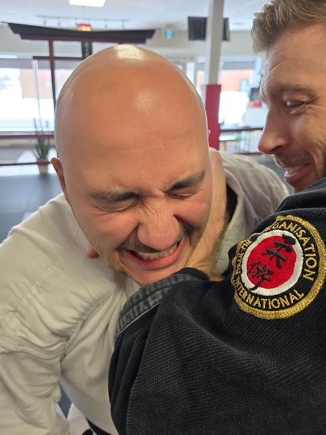 Two martial artists training together